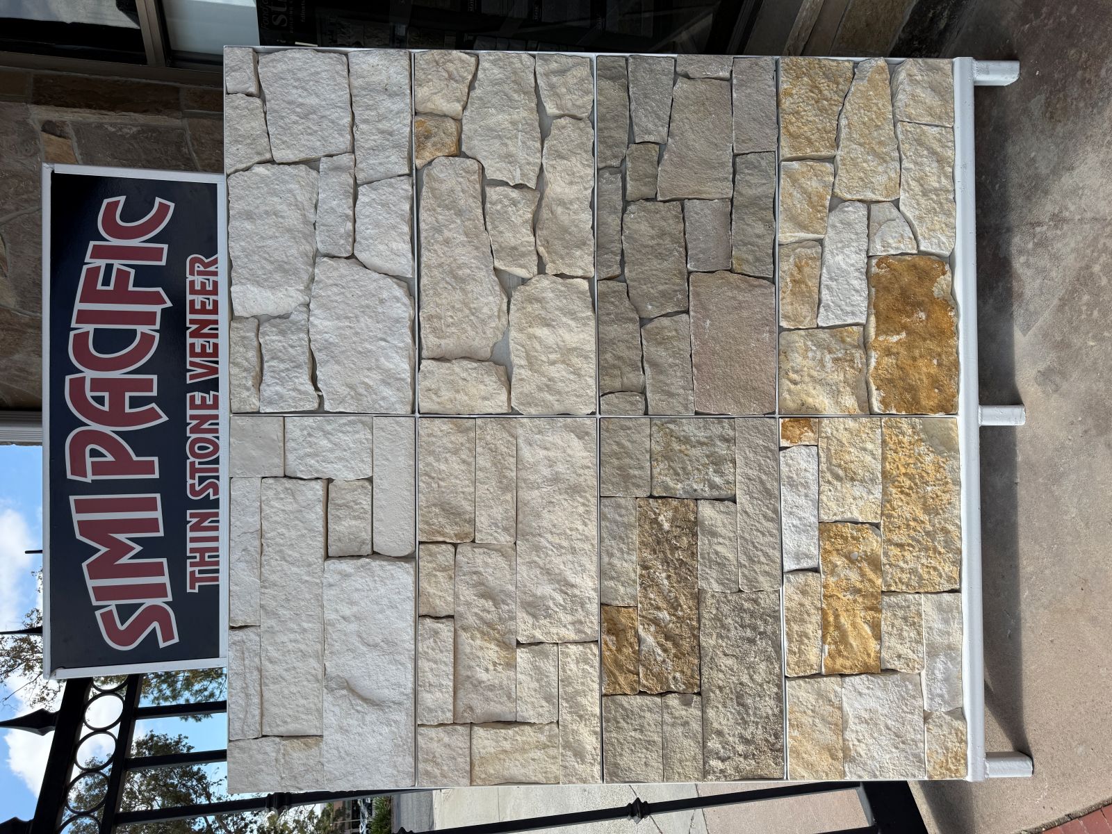 Simi Pacific Thin Stone Veneer display stand showing rows of natural stone veneer color samples
