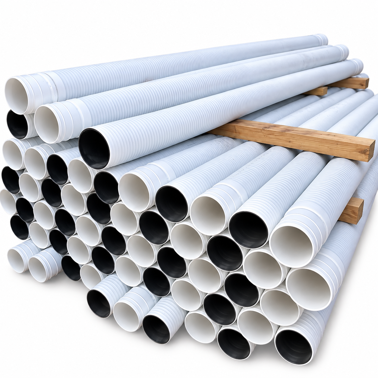 Stack of white corrugated sewer and drain pipe at Simi Pacific